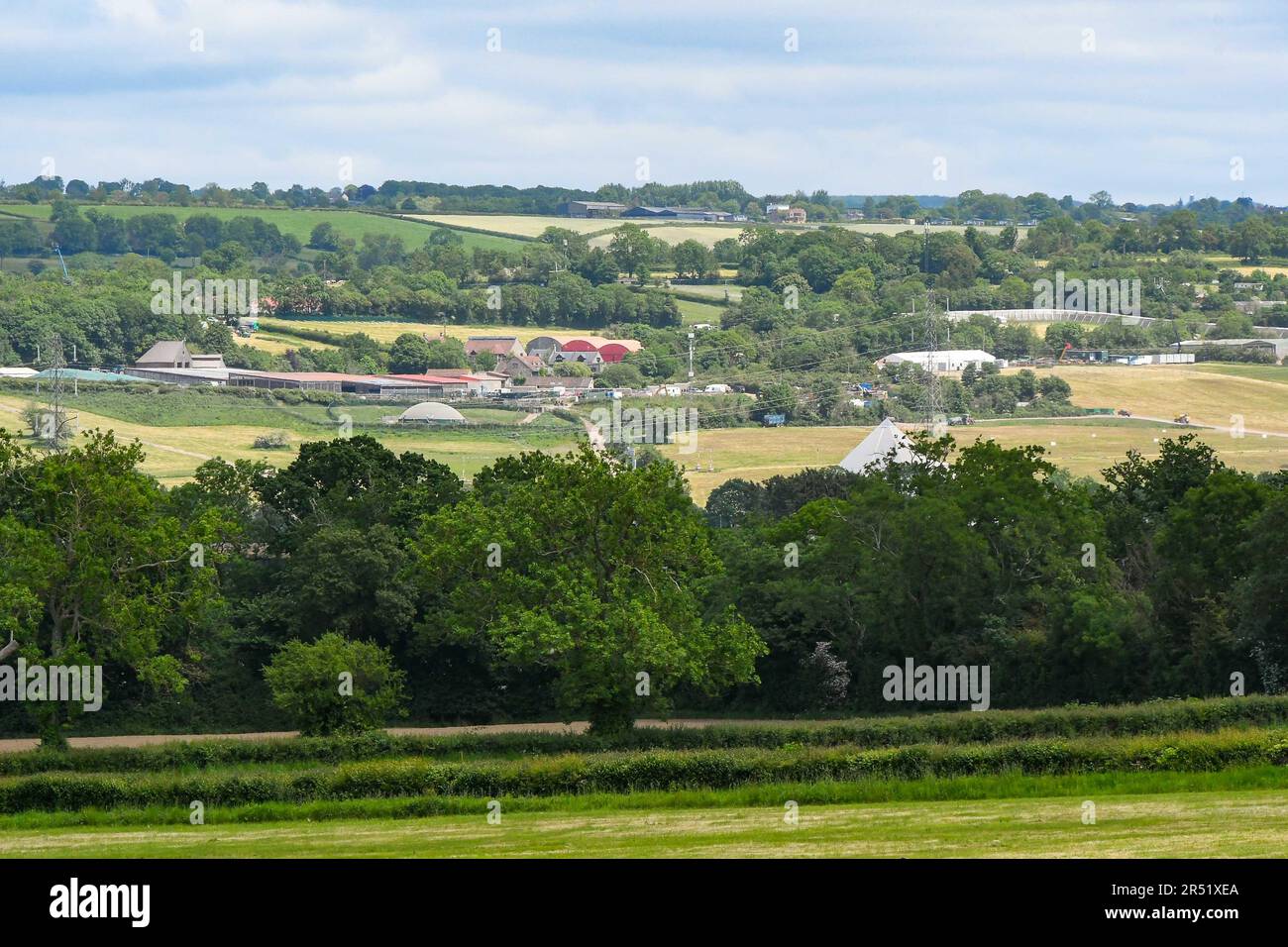 Pilton, Somerset, UK.  31st May 2023.  UK Weather.  General view of the Glastonbury Festival site at Worthy Farm at Pilton in Somerset on a hot sunny afternoon, which is being readied for this years music festival which is being held from 21st to 25th June 2023.  The security fencing which surrounds the site has been constructed.  Picture Credit: Graham Hunt/Alamy Live News Stock Photo