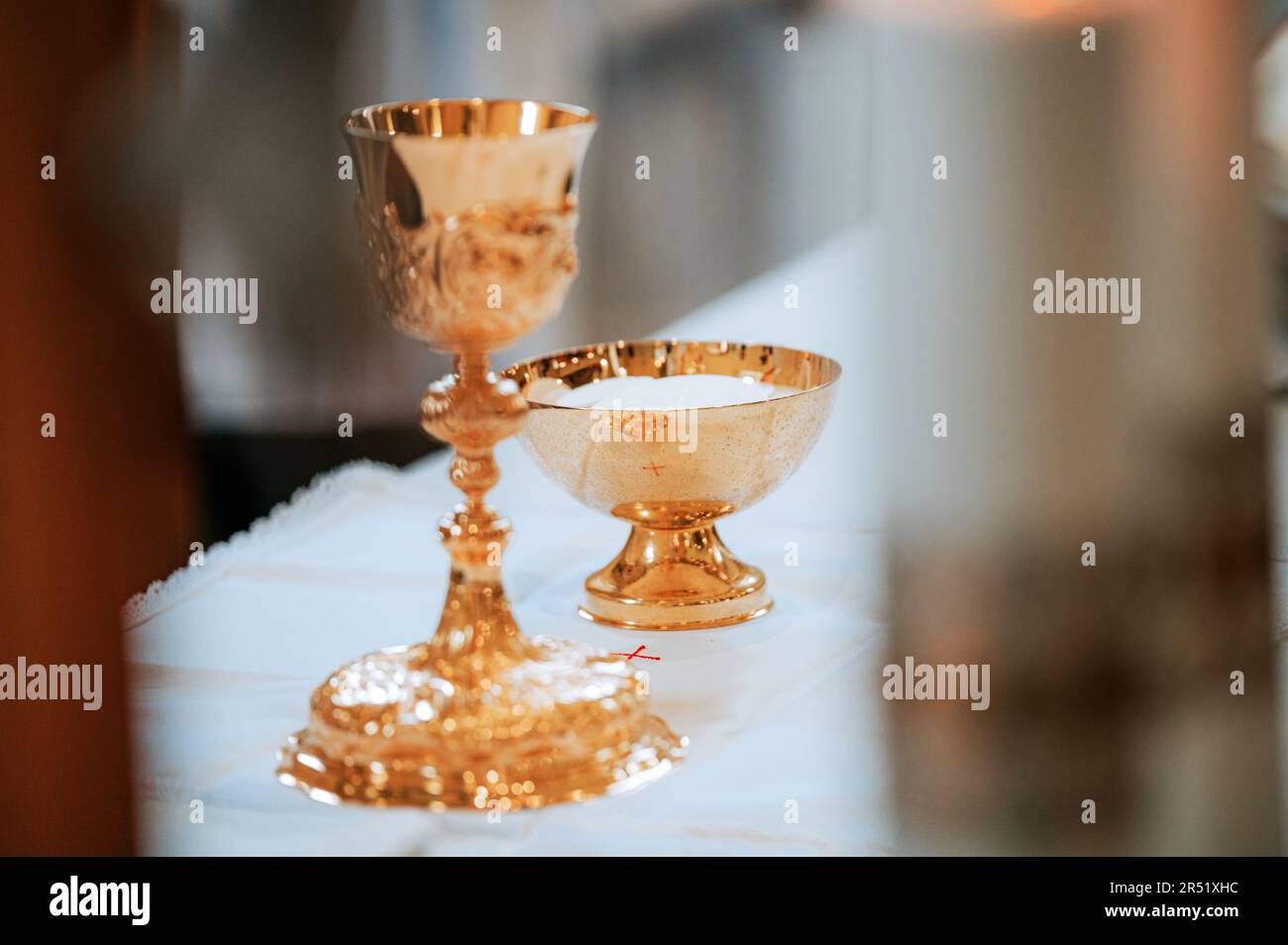 Capturing the Sacred Symbolism: A Image of the Chalice and Eucharistic Vessel During a Momentous Holy Mass in a Timeless Church Setting Stock Photo