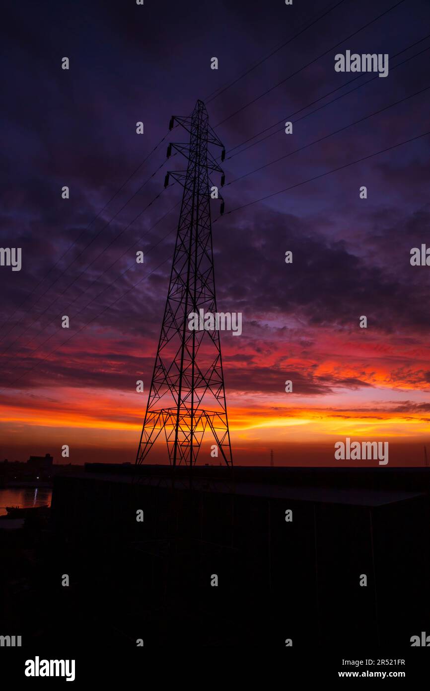 High voltage power line tower with beautiful sky at sunset, stock photo ...