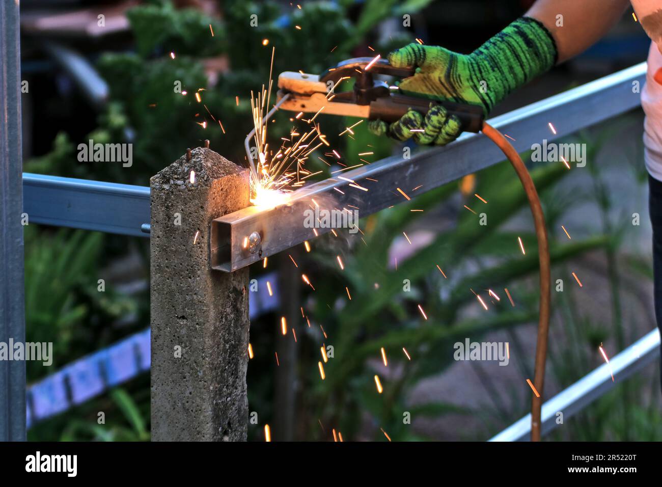 Welder. Construction work and welding industry. Work that often causes accidents caused by sparks. work safety protection concept Stock Photo