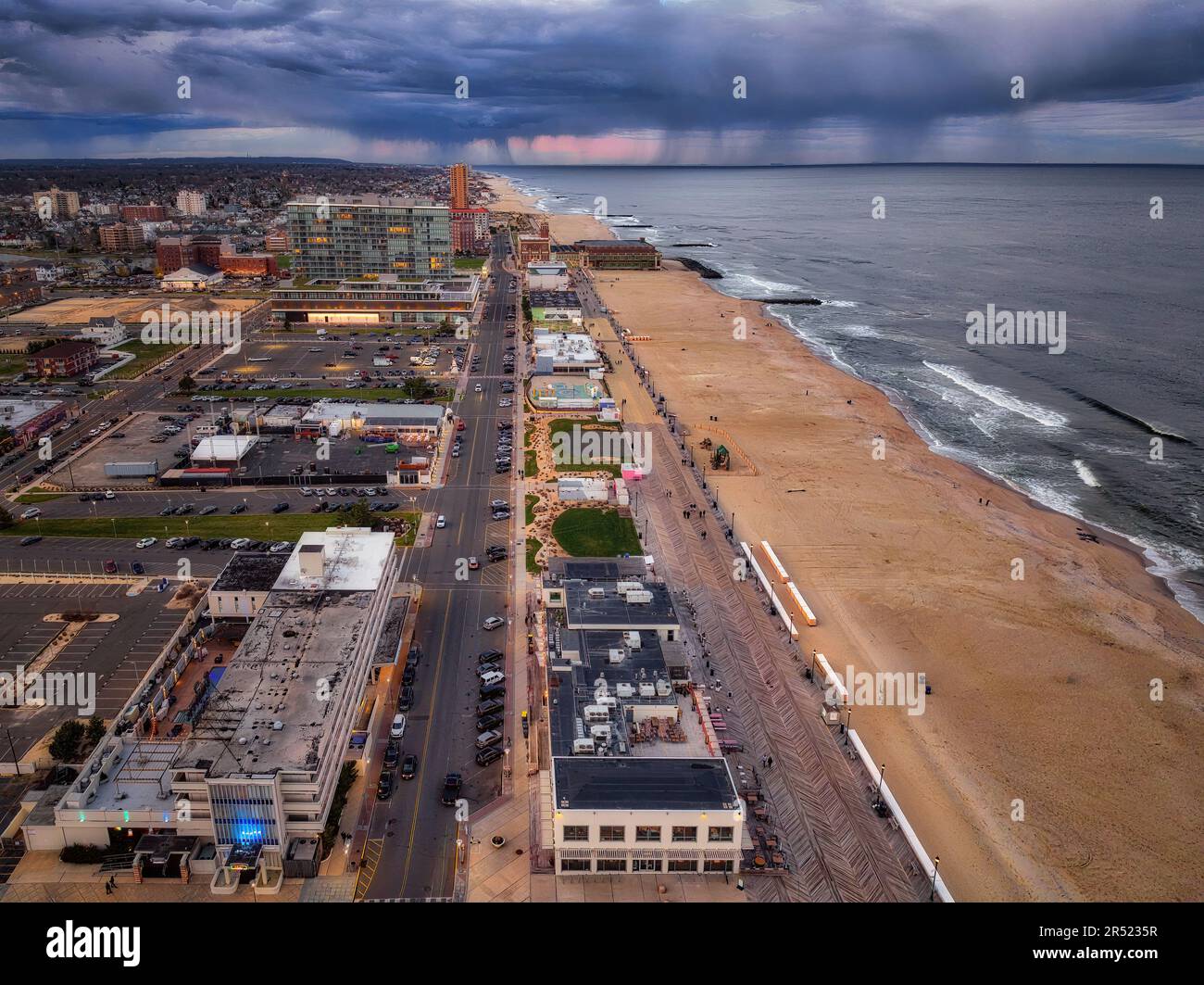 Asbury Park Boardwalk Aerial NJ - Aerial view of the boardwalk at Asbury Park Beach with a stormy sky over the New York City area.  This image is avai Stock Photo