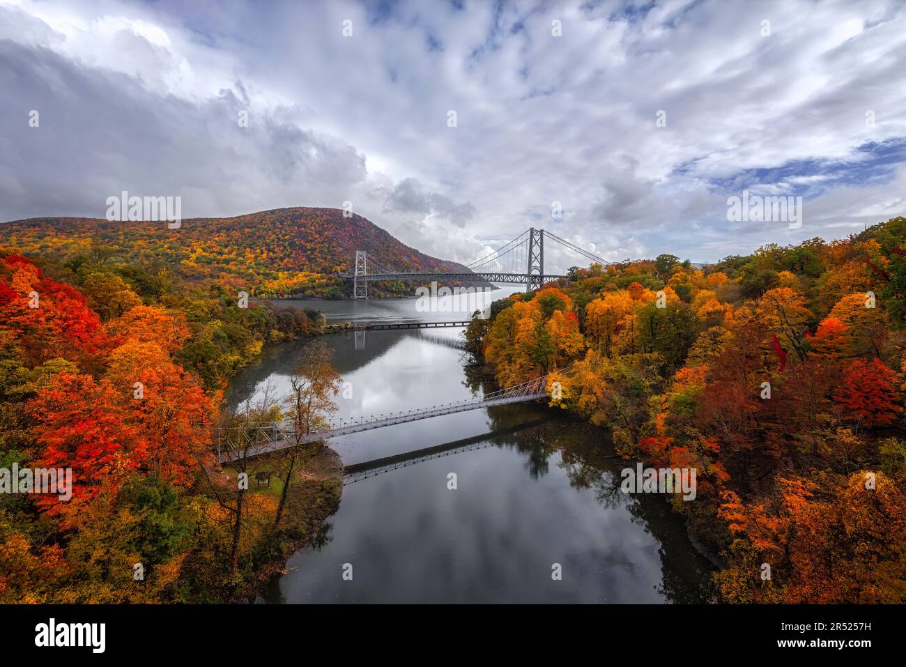 Bear Mountain Fall Fog - View Bear Mountain Bridge State Park during the peak of fall foliage. The Popolopen footbridge is also seen from this upper v Stock Photo