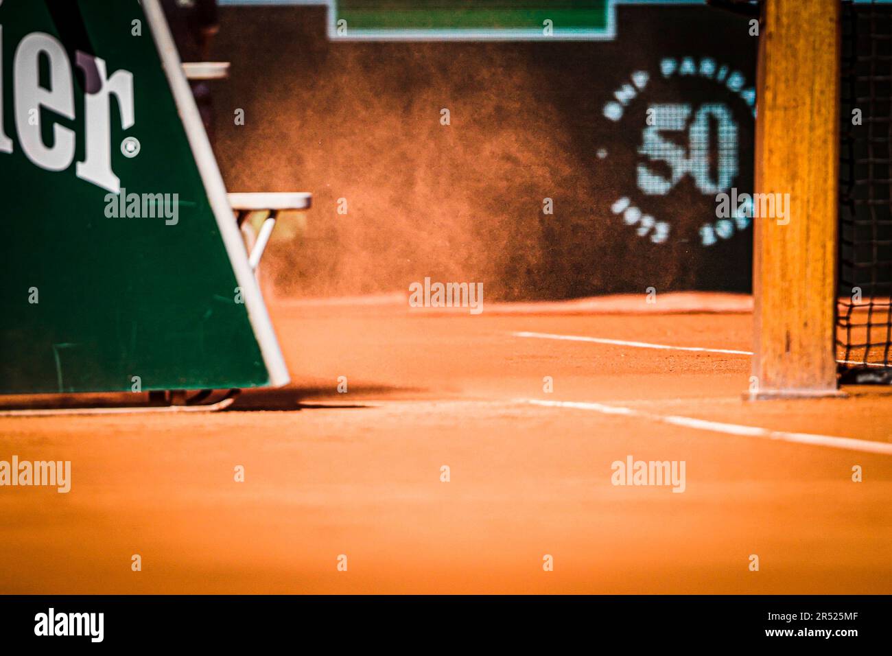 Paris, France. 31st May, 2023. Wind and sand blow across the centre court at the Stade Roland