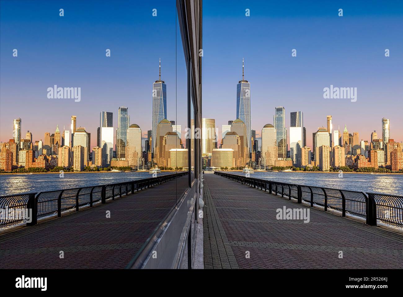 NYC Skyline Reflections - The NYC skyline with One World Trade Center, coined the Freedom Tower in lower Manhattan. Stock Photo