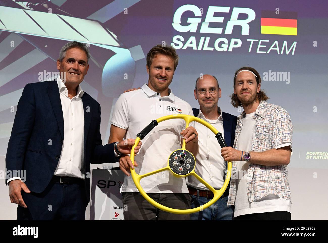 Duesseldorf, Germany. 31st May, 2023. Sailing icon Sir Russell Coutts (l-r), sailor Erik Heil, sponsor Thomas Riedel and former German Formula 1 world champion Sebastian Vettel at the announcement that Vettel will be involved in sailing in the future. The 35-year-old is joining the Germany SailGP team as a co-owner. Vettel and entrepreneur and racing stable owner Thomas Riedel presented their project at the SpoBis sports congress in Düsseldorf. Credit: Roberto Pfeil/dpa/Alamy Live News Stock Photo