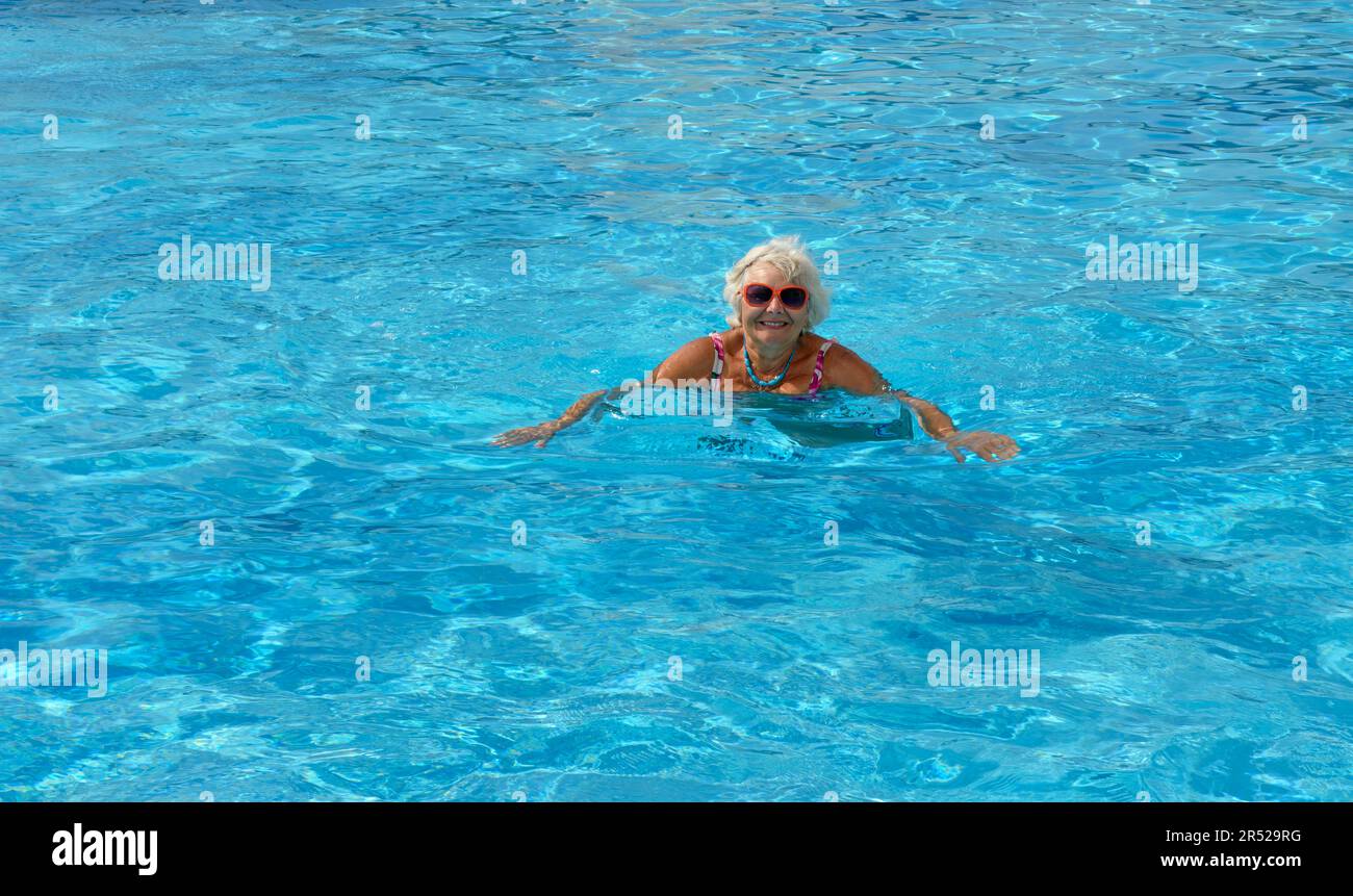 Elderly woman in swimming pool hi-res stock photography and images - Alamy