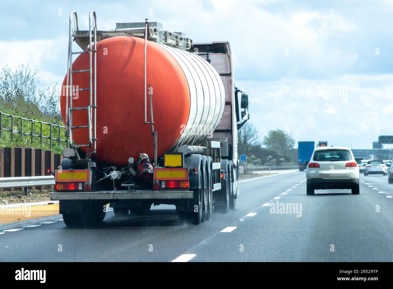 A fuel tanker traveling along a motorway in the United Kingdom Stock Photo