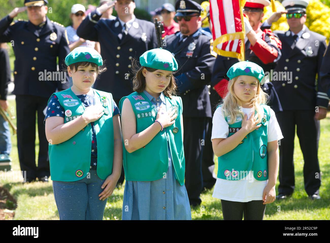 Memorial Day Event.  Dennis, Massachusetts, (Cape Cod) , USA.  Girl Scouts at the playing of the National Anthem Stock Photo