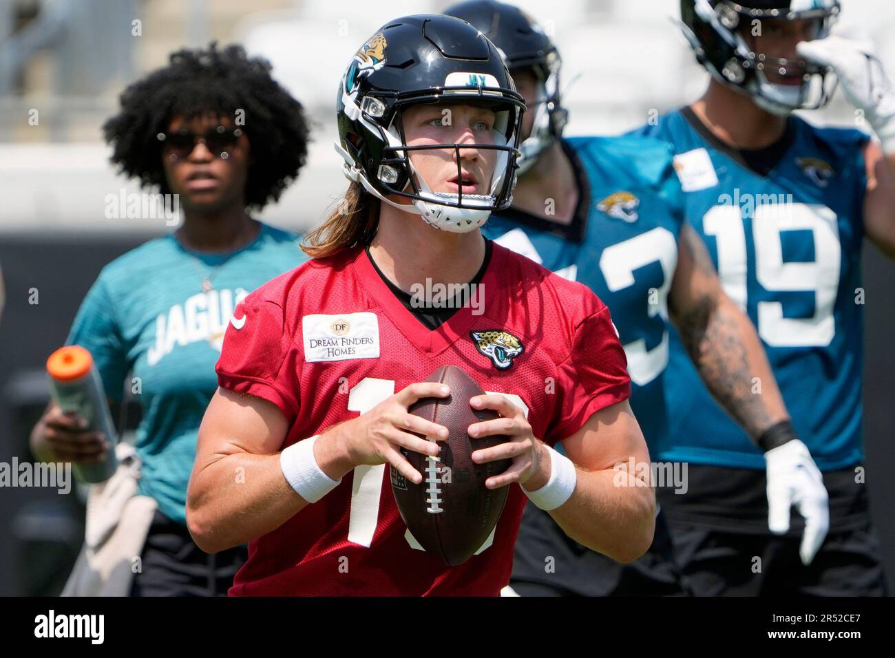 Jacksonville Jaguars quarterback Trevor Lawrence (16) looks for a