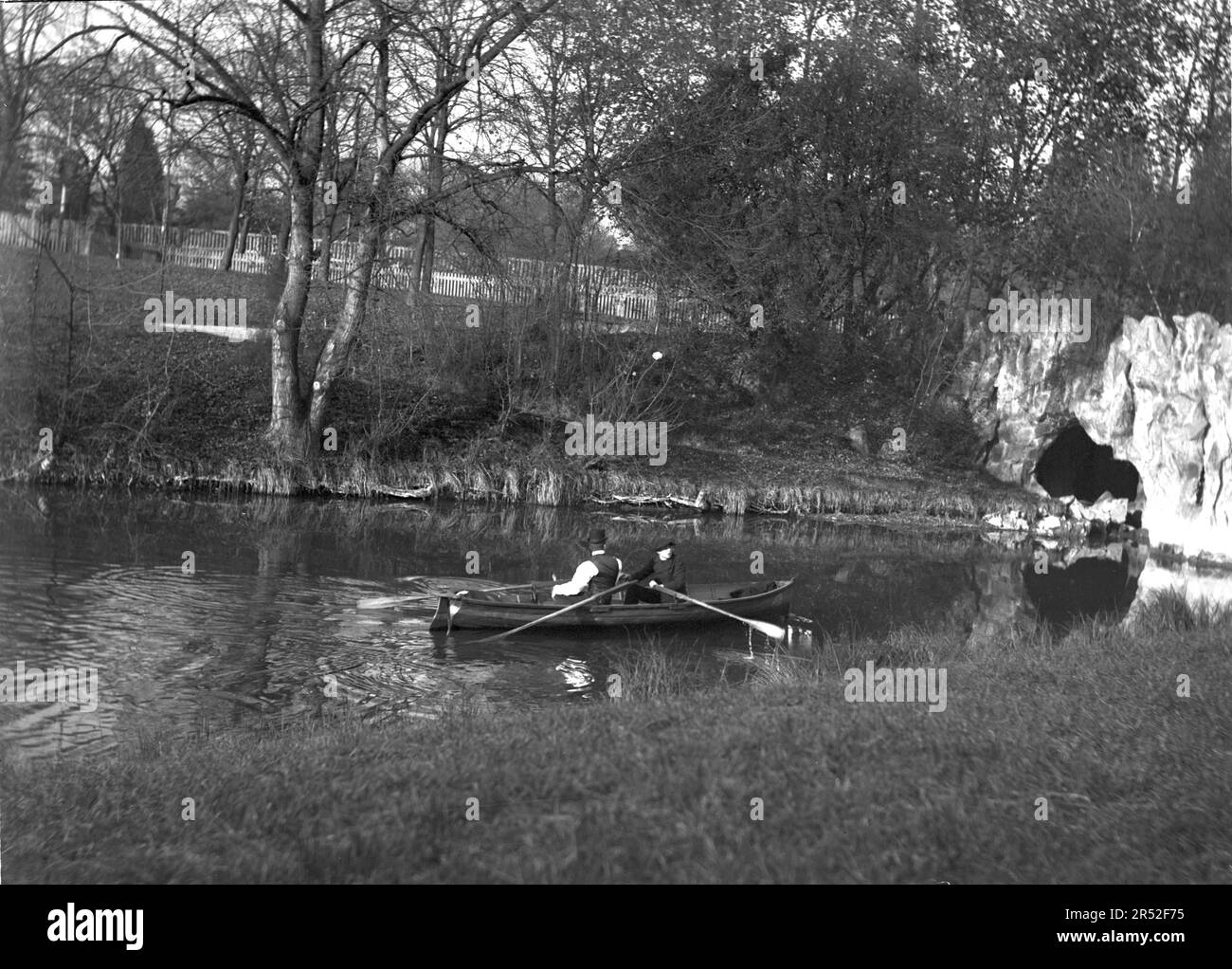 Two Young Men Rowing In A Boat Beginning Of 20th Century This Is An two-young-men-rowing-in-a-boat-beginning-of-20th-century-this-is-an