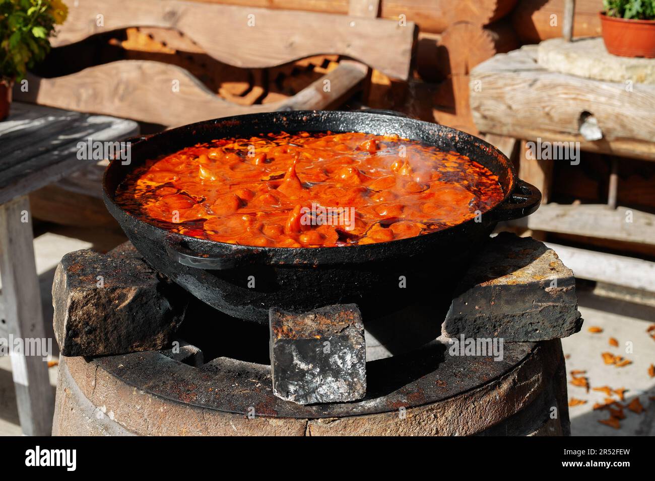 pot of soup is cooked over the fire Stock Photo Alamy