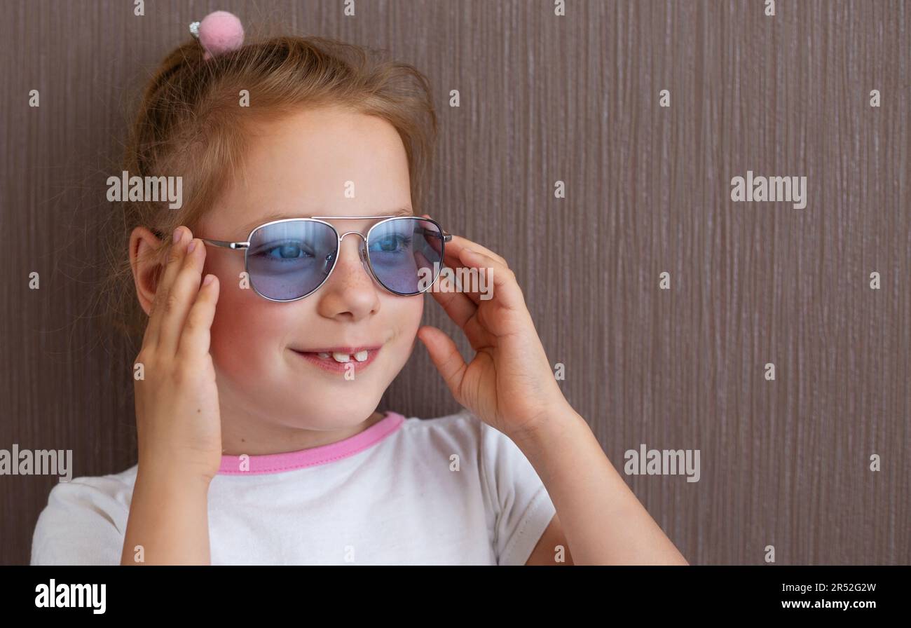 Fashion Cute child girl in sunglasses Stock Photo
