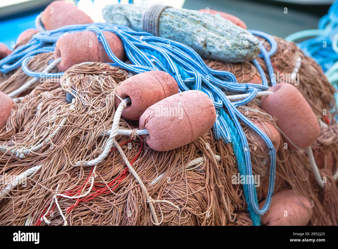 Fishing nets and buoys in the harbour of Port de Centuri, Corsica, France Stock Photo