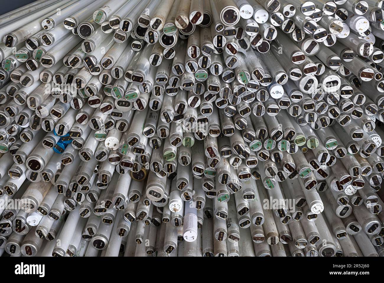 Broken fluorescent tubes stacked in a container, Bavaria, Germany Stock