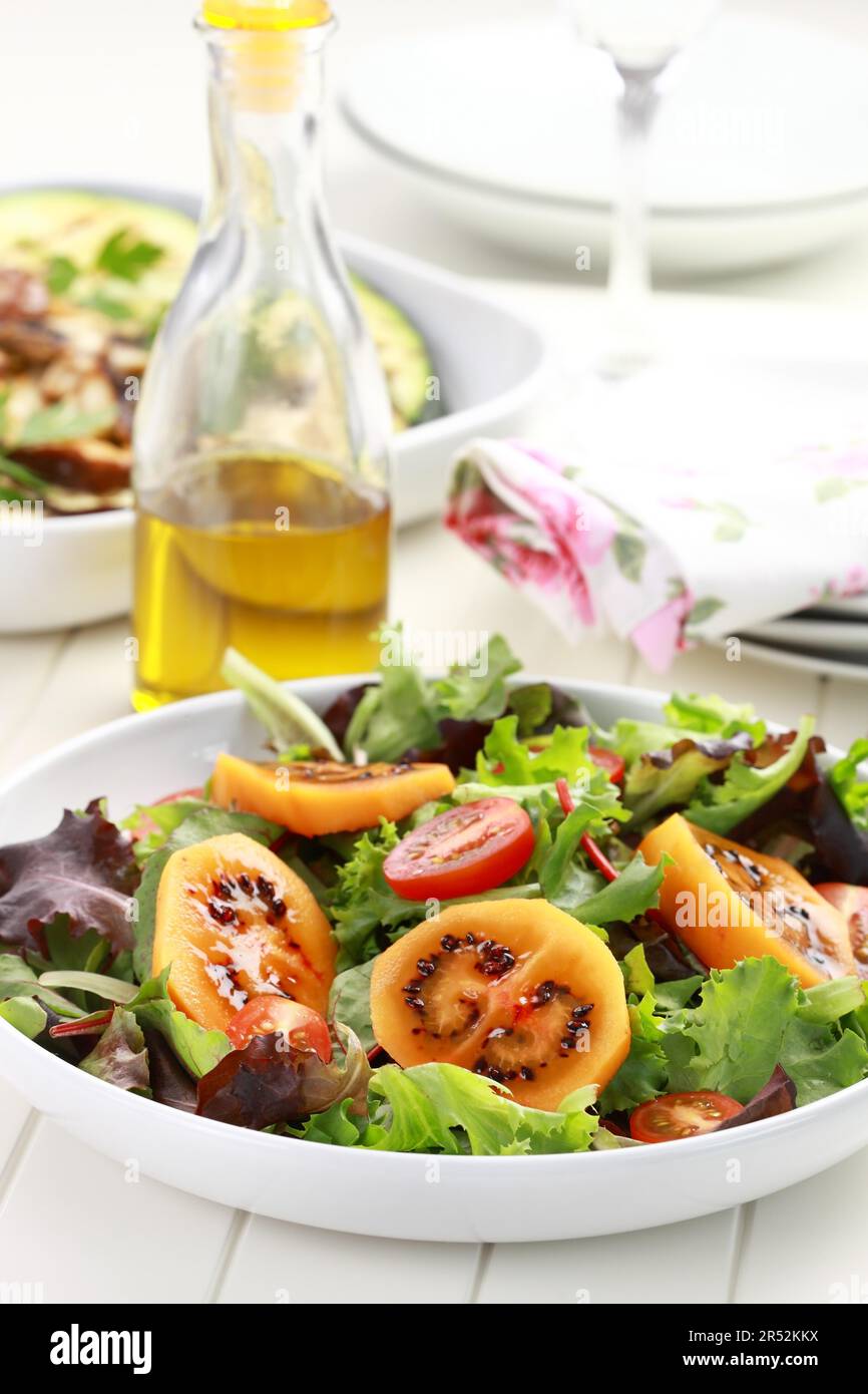 Salad with tamarillos and olive oil Stock Photo