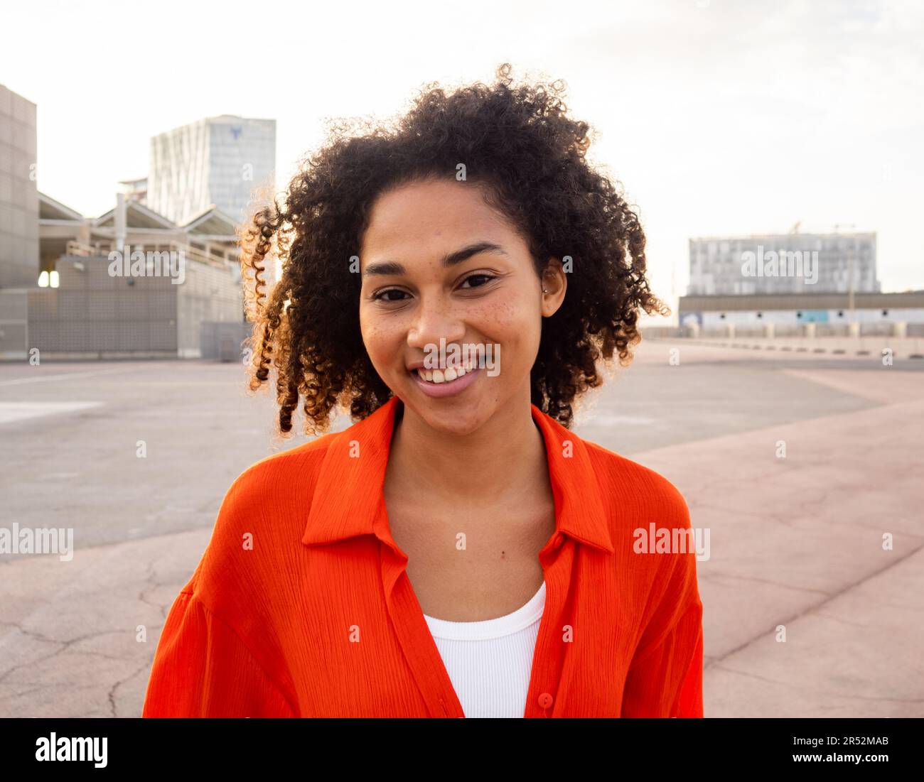 Young cheerful smiling african american woman looking at camera. Positive emotions woman Stock Photo