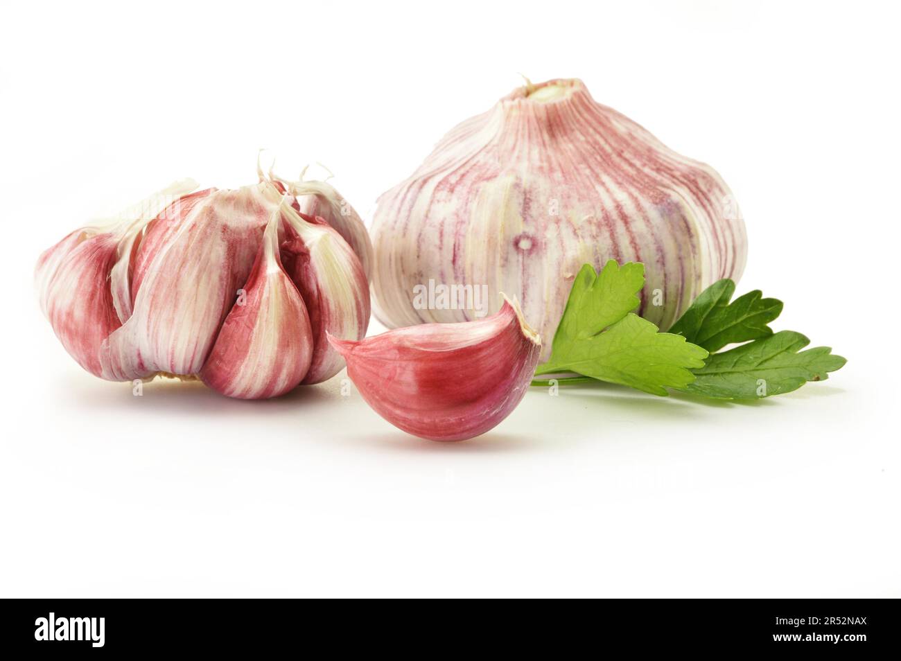 Fresh garlic with parsley isolated on white Stock Photo - Alamy