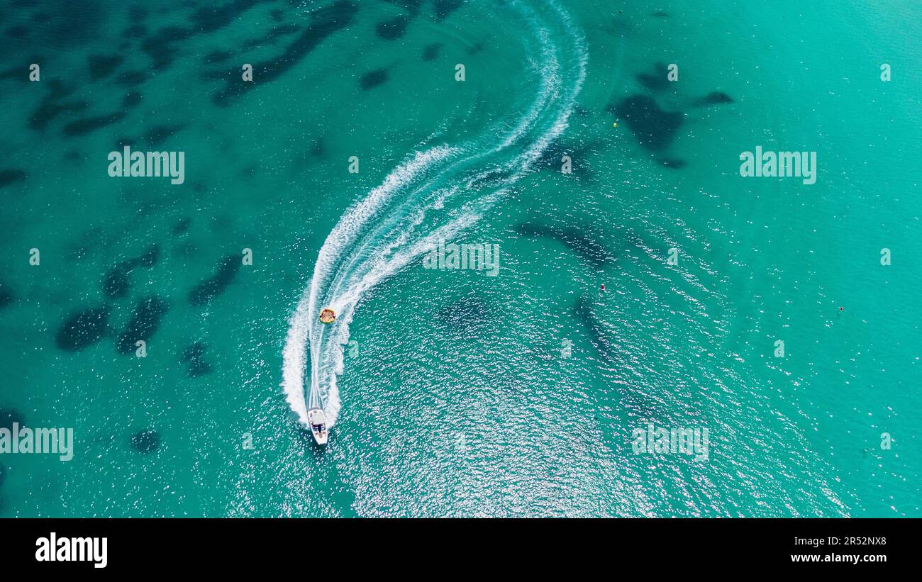 Aerial view on motorboat and jetski on the sea surface Stock Photo - Alamy