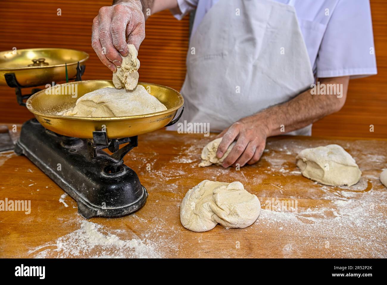 View of Baker kneading artisan bread in the bakery Stock Photo - Alamy
