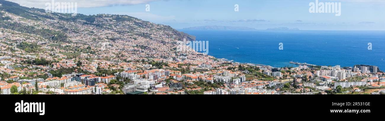 Madeira Island Portugal - 04 21 2023: Full panoramic aerial view of the city of Funchal and Camara de Lobos, tourist and iconic city on the island of Stock Photo