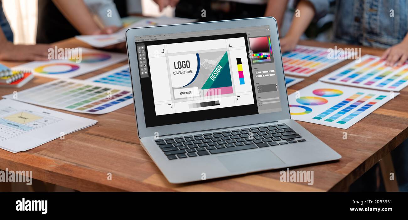 Panorama focus view of laptop display digital art workspace for graphic designer with blurred background of graphic team brainstorm and working on Stock Photo