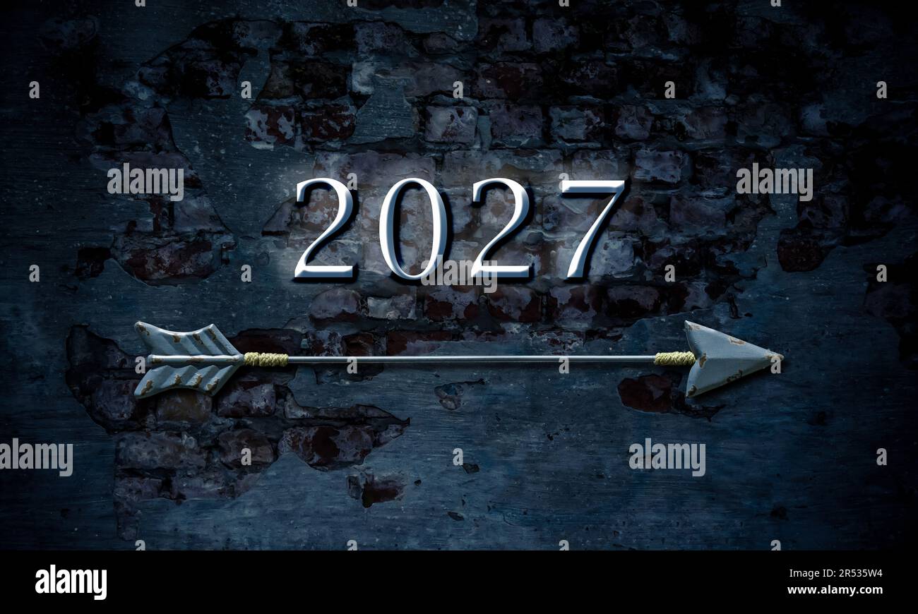 Image of a signpost pointing in the direction of the year 2027 Stock