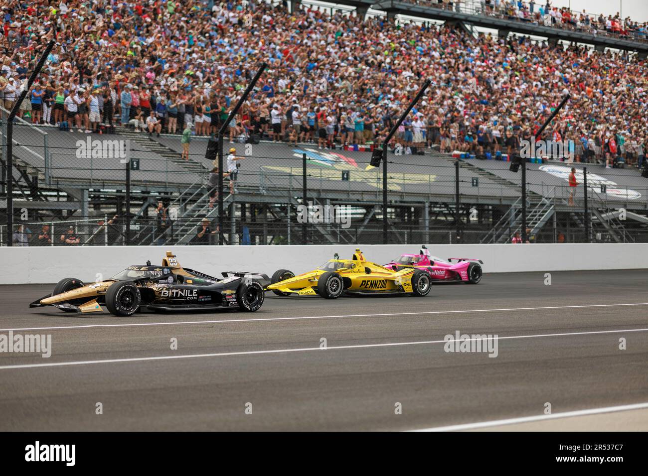 INDIANAPOLIS, INDIANA, UNITED STATES - 2023/05/28: Ed Carpenter Racing driver Rinus VeeKay (21) of Netherlands, Team Penske driver Scott McLaughlin (3) of New Zealand and  driver Kyle Kirkwood (27) of United States make a parade lap during the 2023 Indy 500 at Indianapolis Motor Speedway in Indianapolis. Stock Photo