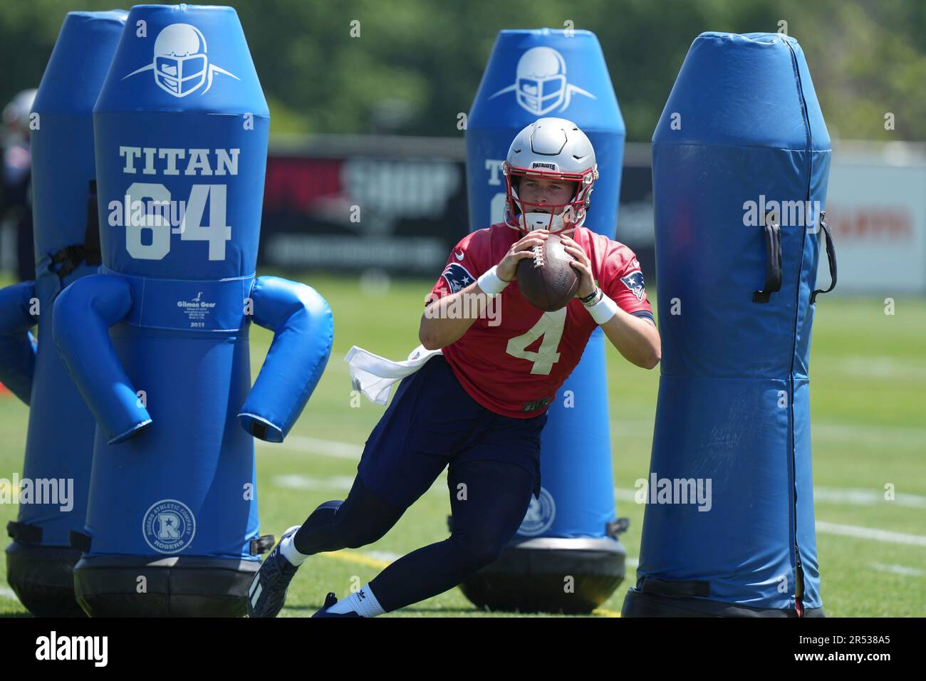 New England Patriots quarterback Bailey Zappe performs field