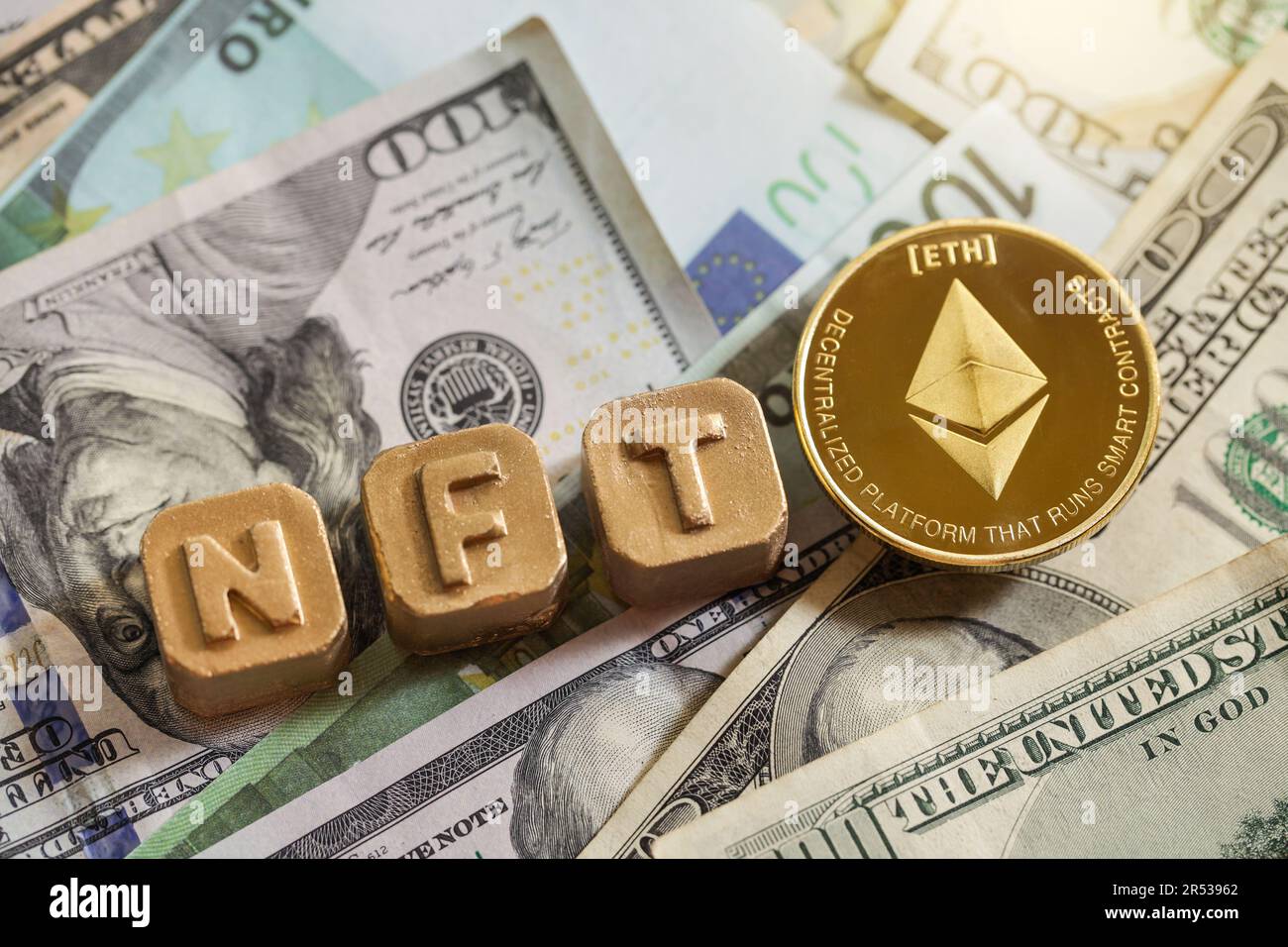 Non-fungible token. Gold letter NFT and coin Ethereum. Blockchain  cryptocurrency coin on background of dollars Stock Photo - Alamy