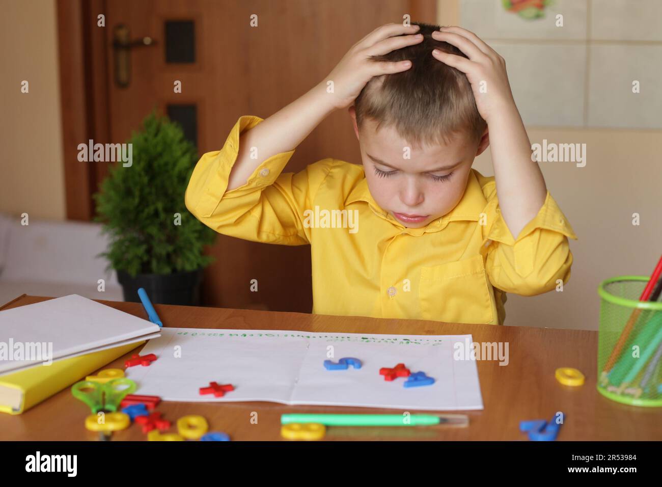 Homeschooling. Caucasian boy with difficulty learning lessons, stress