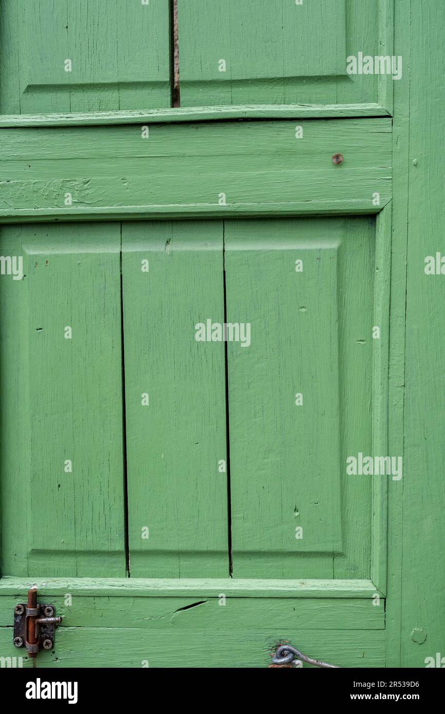 Green wooden shutters of an old cottage Stock Photo - Alamy