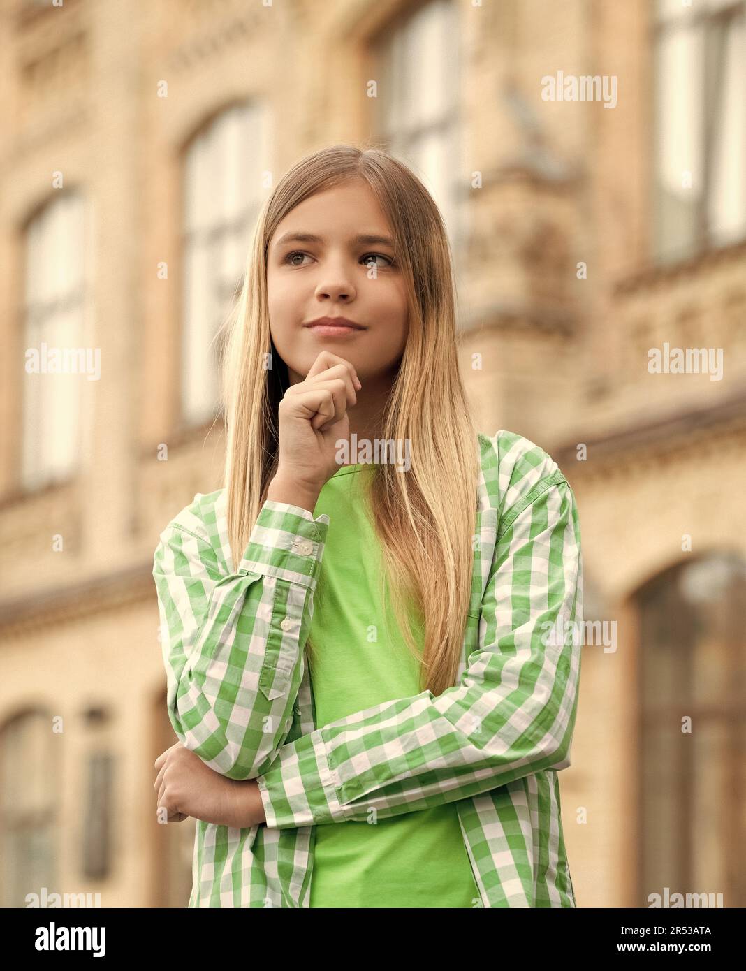 Thoughtful Teen Girl Looking Away In Thinking Pose Blurry Outdoors