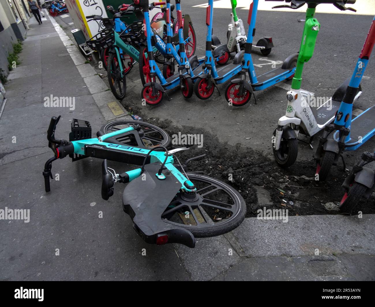 Paris hire bikes strewn across the pavement Stock Photo