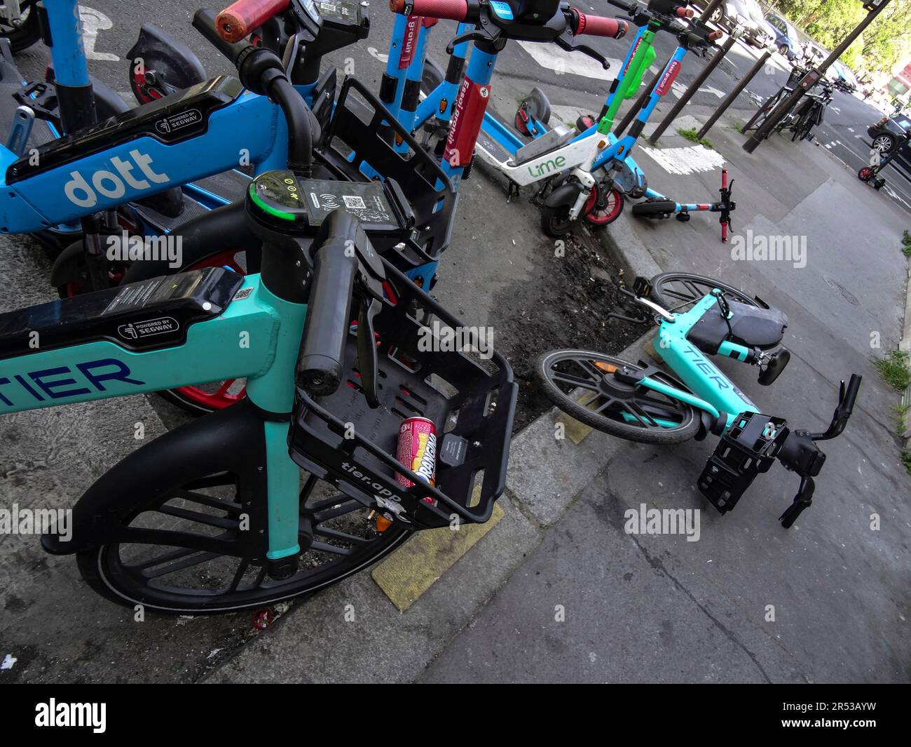 Paris hire bikes strewn across the pavement Stock Photo