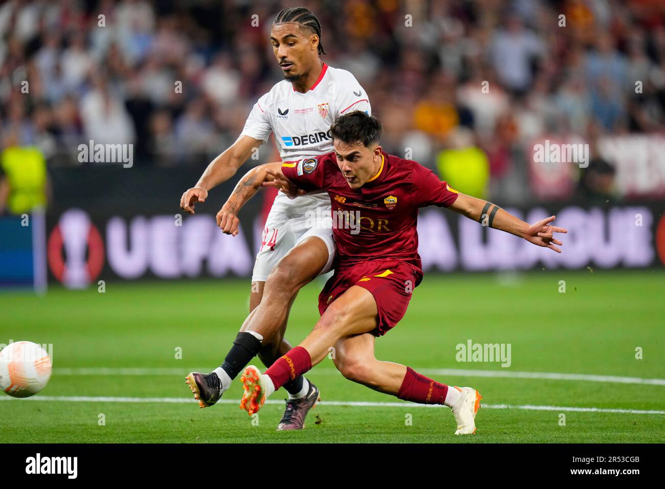 Sevilla's Loic Bade, top, heads the ball past Roma's Tammy Abraham