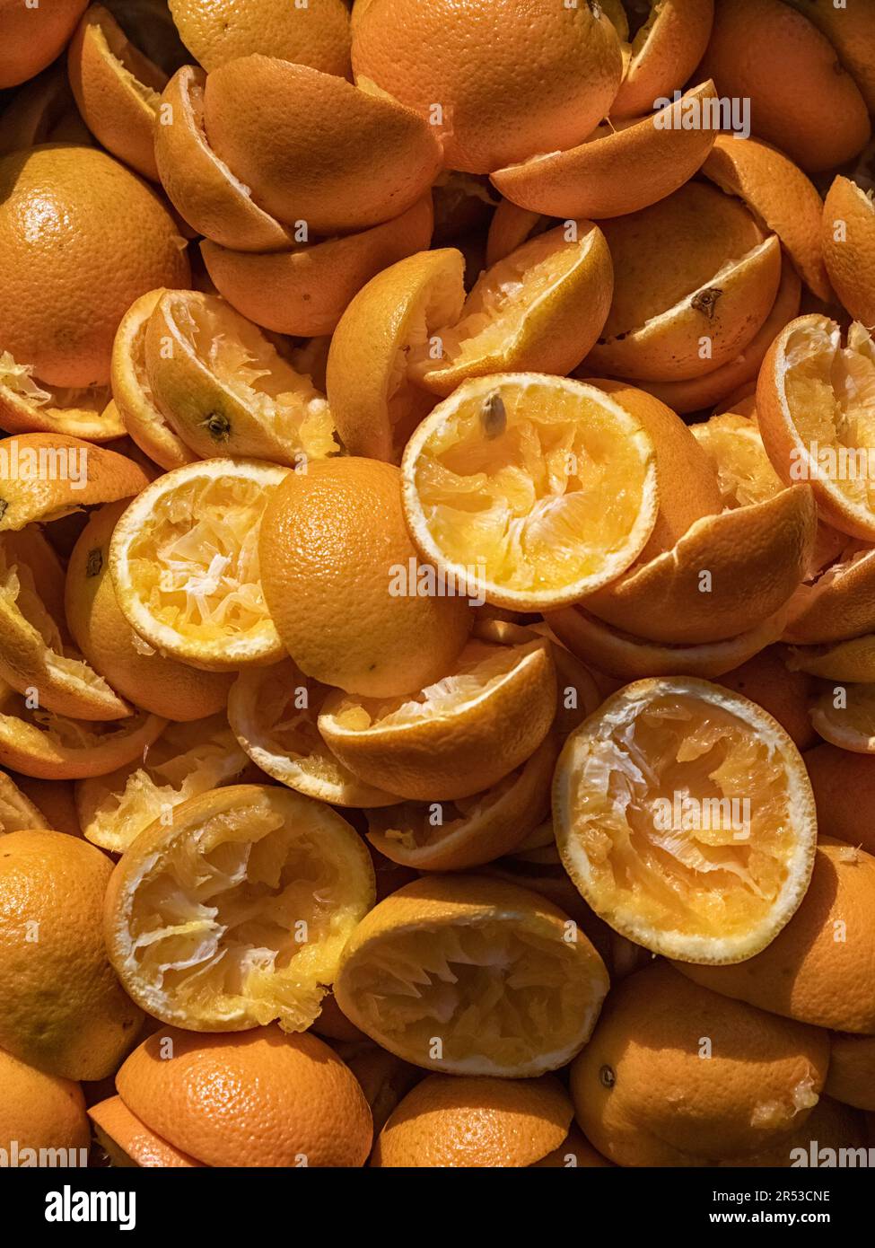 Pile of orange skins that have been used to make fresh orange juice