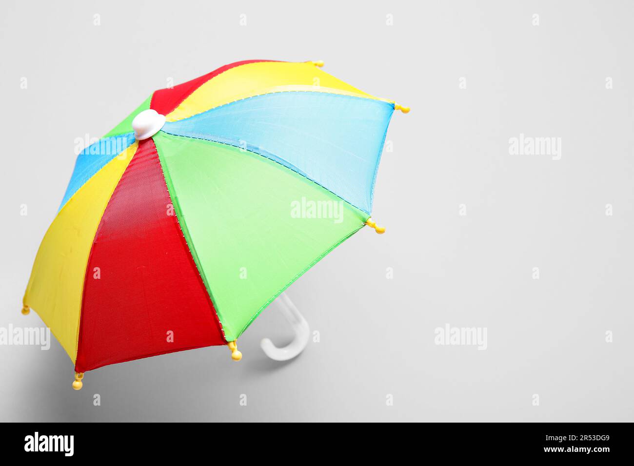 Mini colorful umbrella on white background Stock Photo