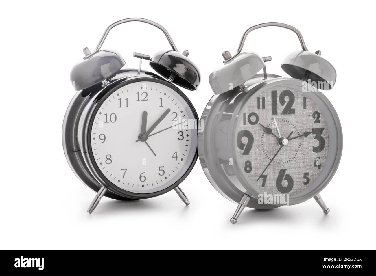 Metal alarm clocks on white background Stock Photo - Alamy