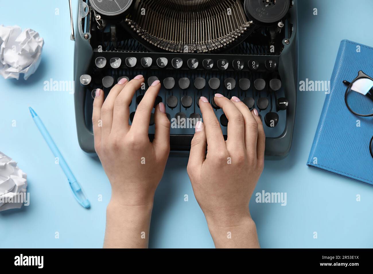 Typing Paper On Computer Woman typing on typewriter with crumpled paper, notebook and eyeglasses ...