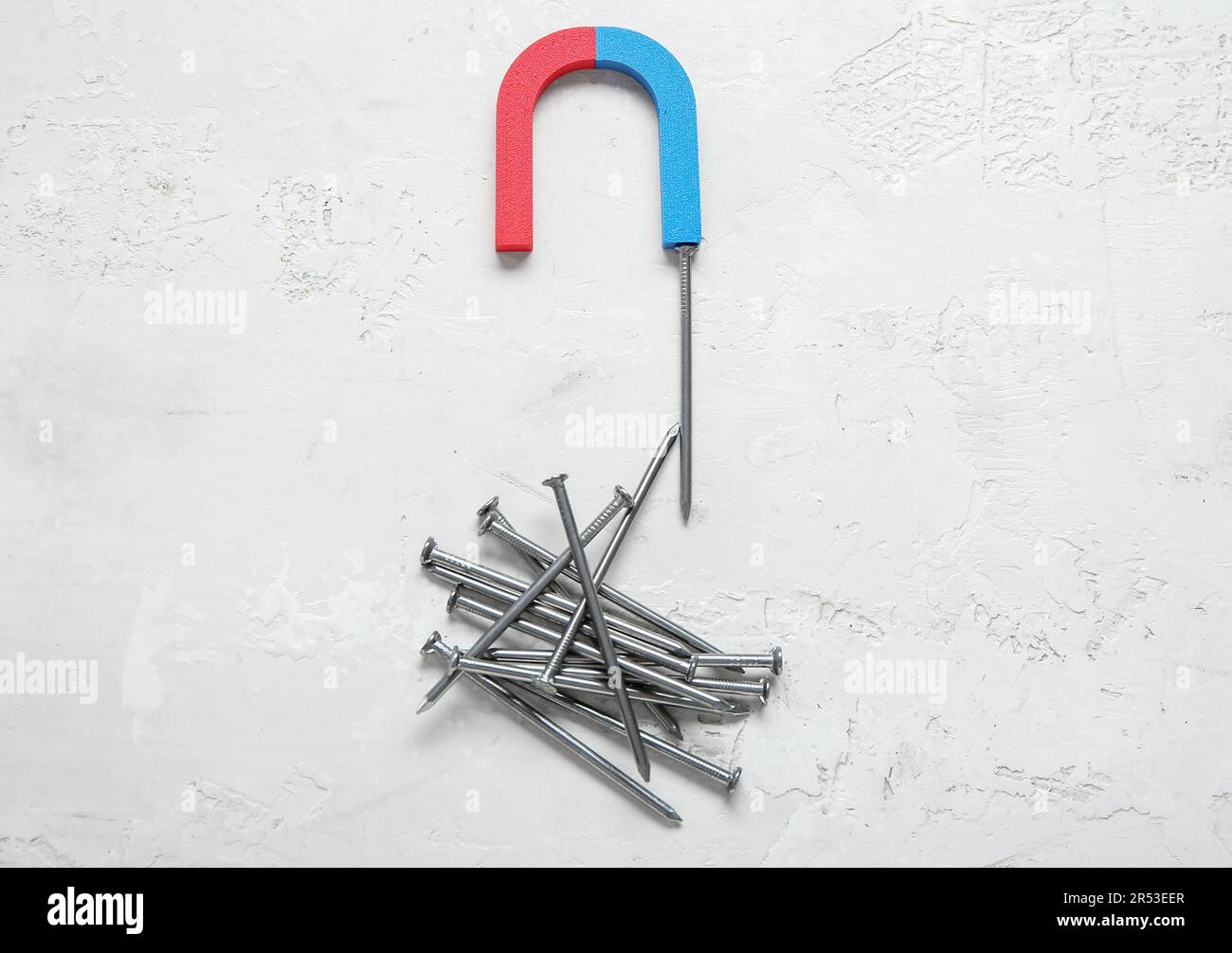 attracting nails on white background Stock Photo Alamy