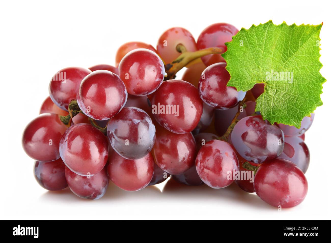 Ripe red grape with leaf isolated on white background Stock Photo