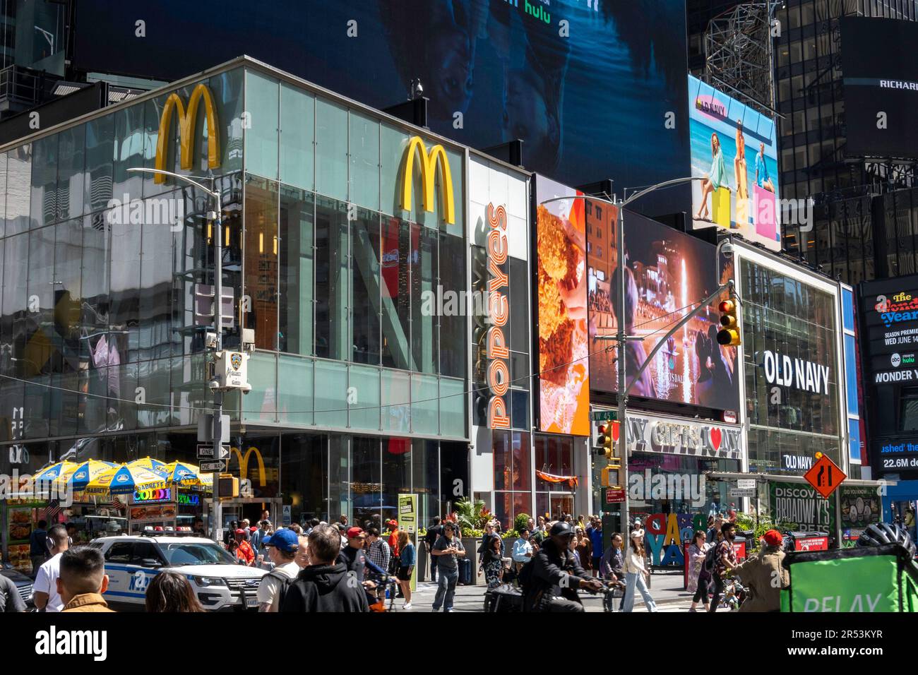 The hustle and bustle of pedestrian and automobile traffic in Times ...