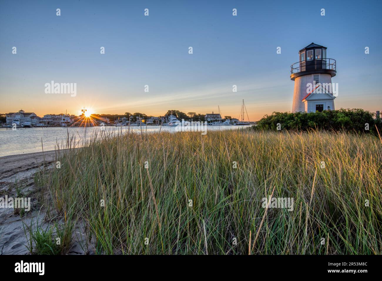 Sunrise at Cape Cod's Hyannis Harbor Lighthouse near Martha's Vineyard, New England USA. Stock Photo