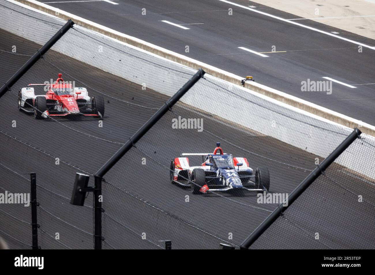 Driver Santino Ferrucci (14) racing in first place against Chip Ganassi Racing driver Marcus Ericsson (8) of Sweden during the 2023 Indy 500 at Indianapolis Motor Speedway in Indianapolis. Stock Photo