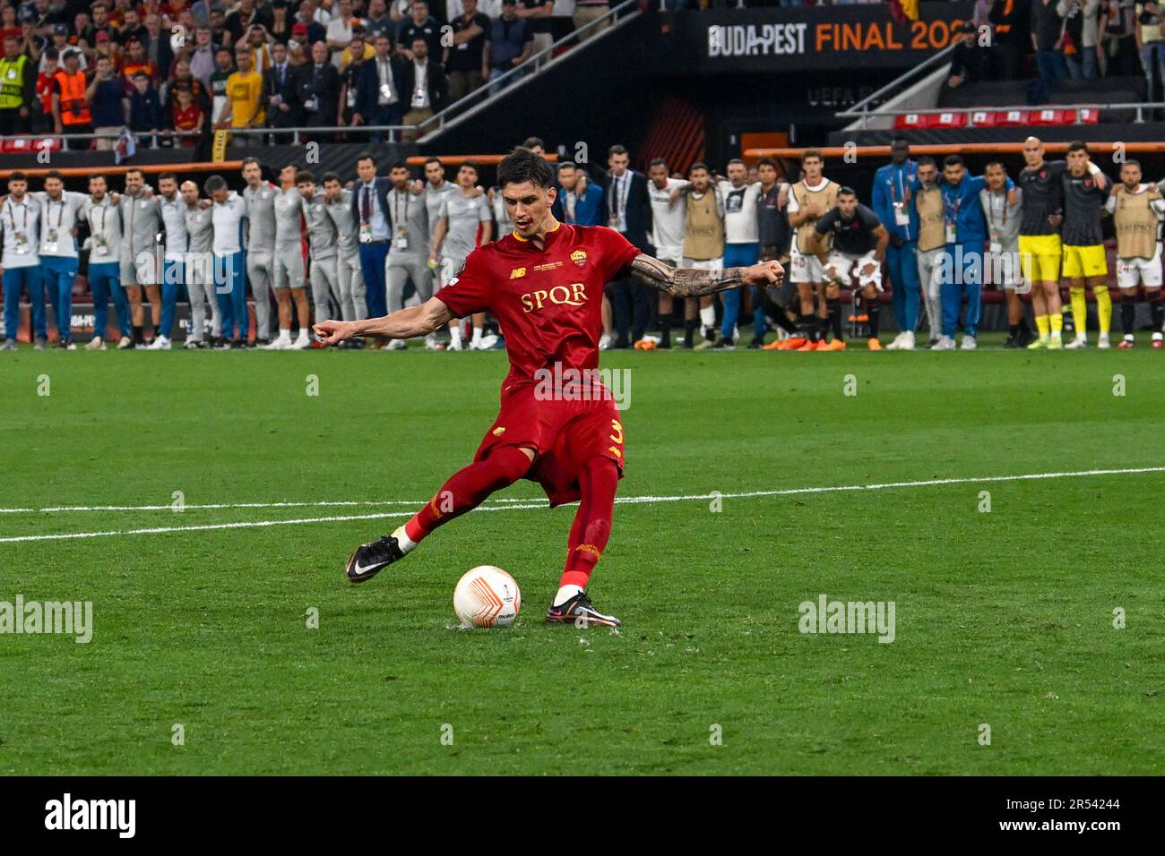 AS Roma’s Roger Ibanez shoots a penalty kick during Europe League final