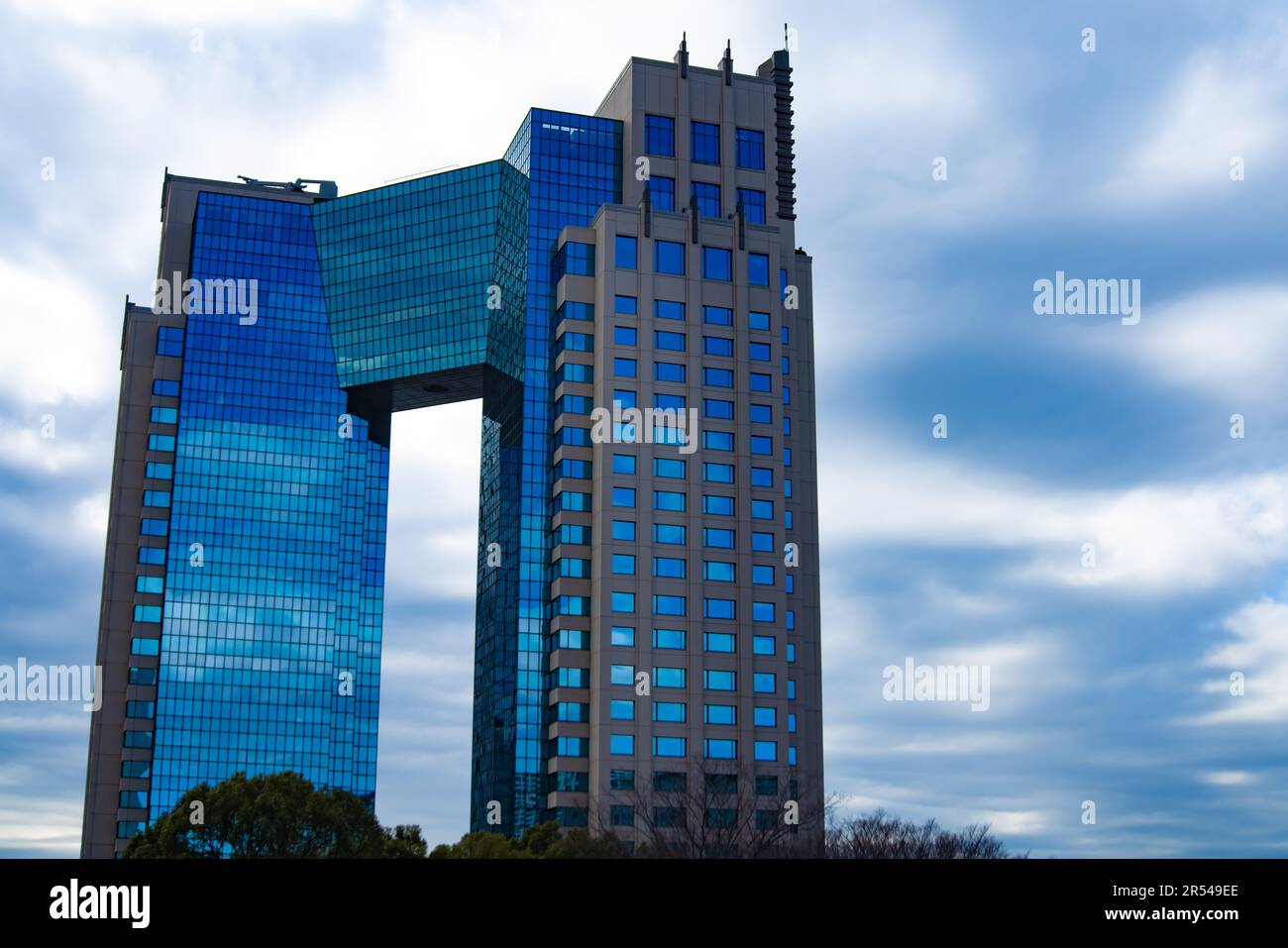 A cloud reflecting an impressive building cloudy wide shot Stock Photo ...