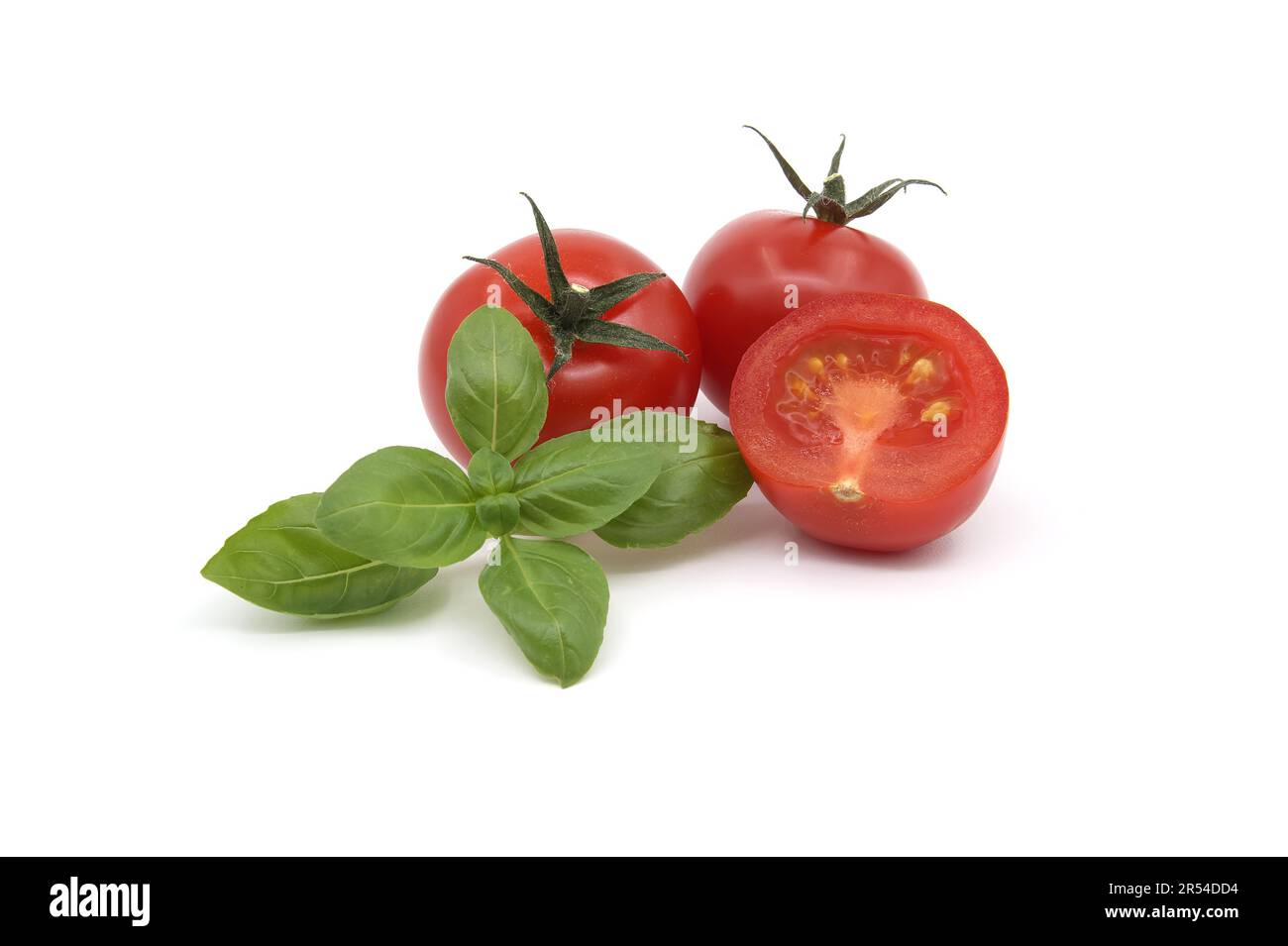Fresh green basil leaves and cherry tomatoes isolated on white ...