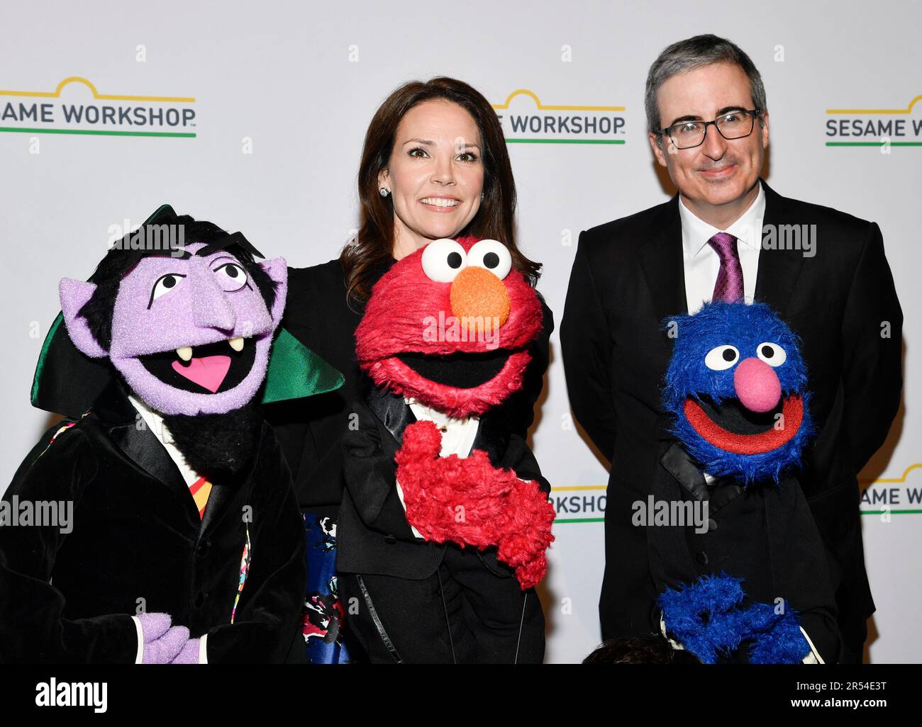 CNN anchor Erica Hill, left, and John Oliver pose with Count von Count