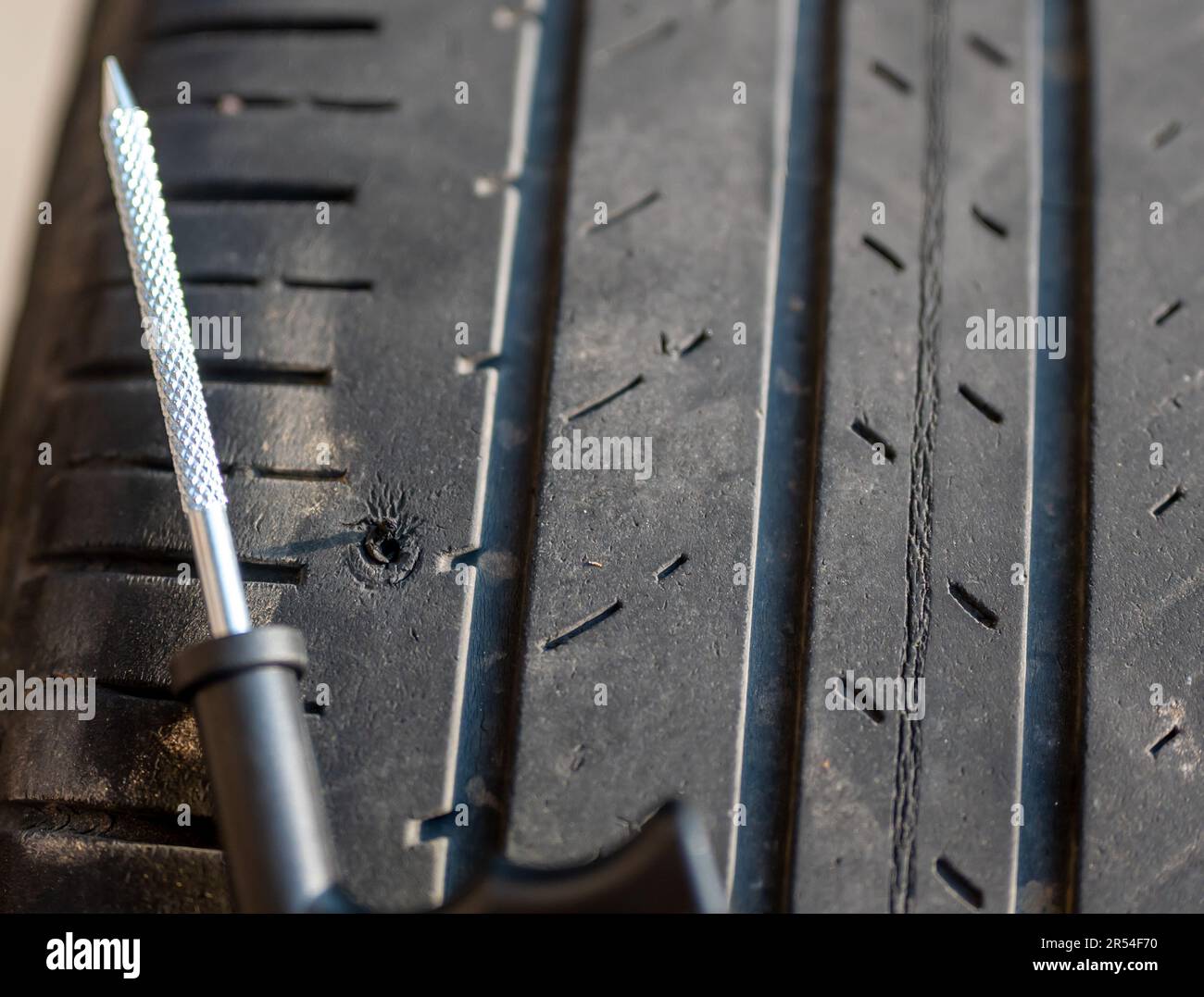 Reaming tool used to scarify and enlarge a tire puncture before inserting a repair plug Stock