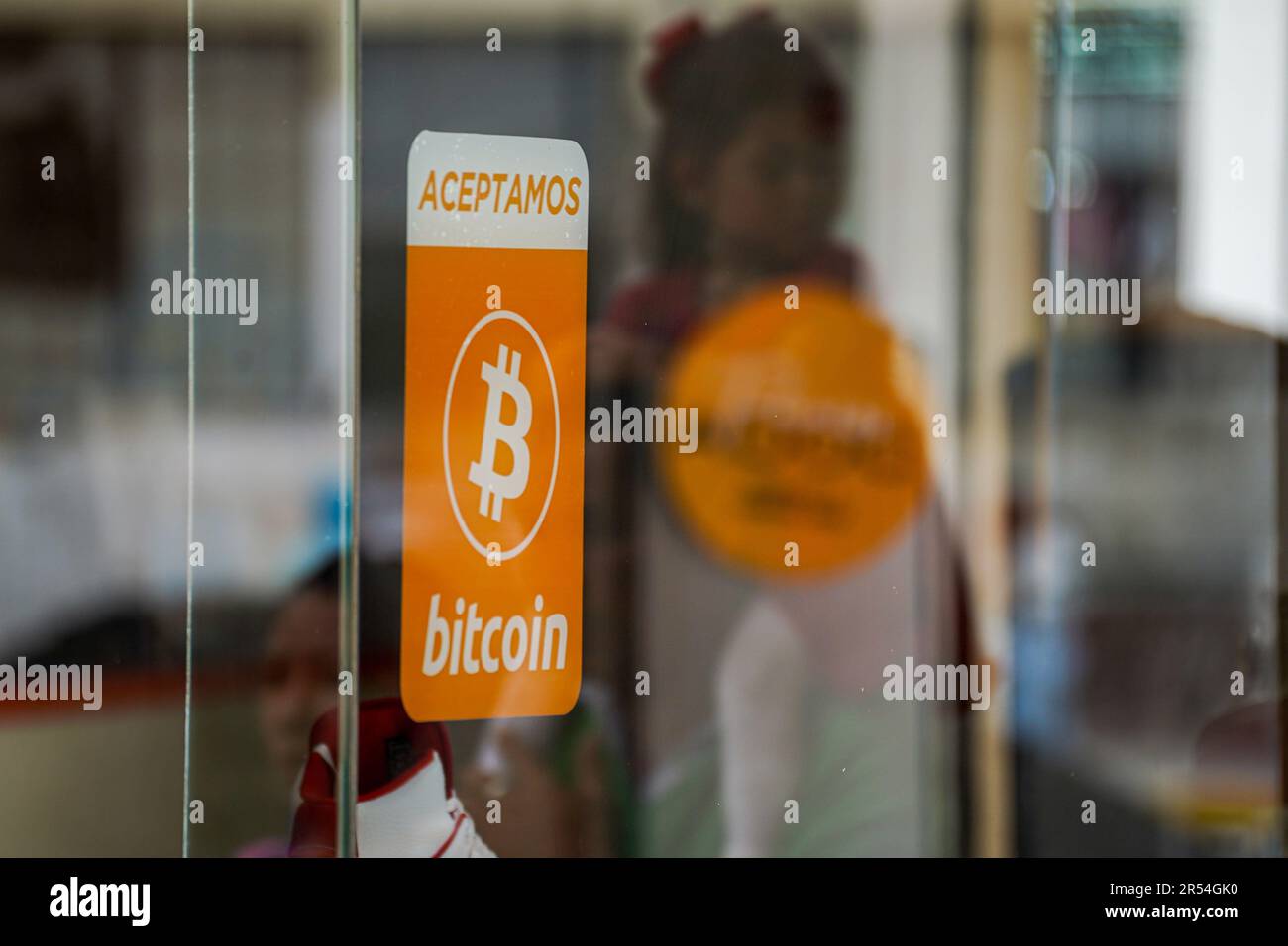 A bitcoin acceptance sign seen in San Salvador. The Bukele administration  has ended its fourth year in office ahead of a questioned reelection bid.  The country has been placed under an ongoing